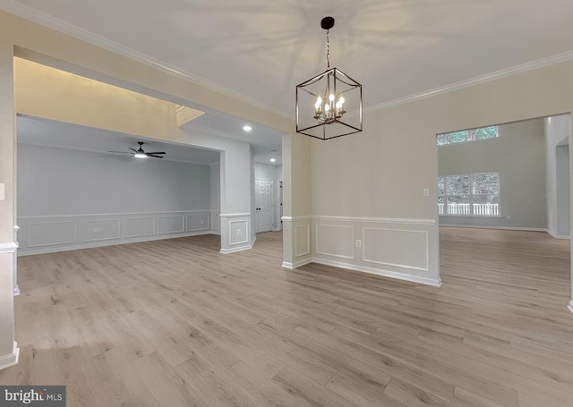 interior space featuring crown molding, light hardwood / wood-style flooring, and ceiling fan with notable chandelier