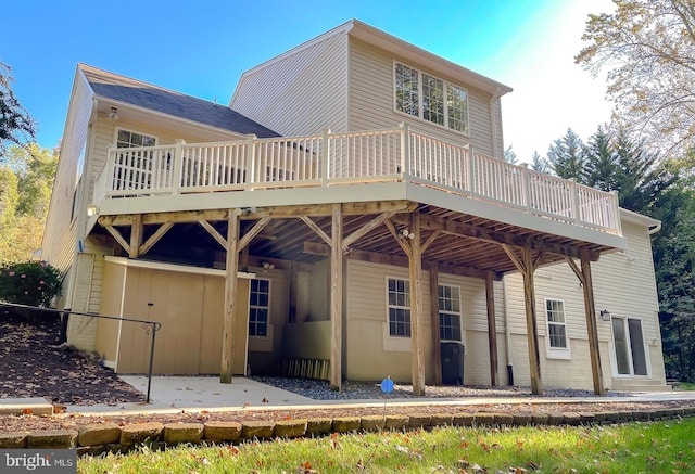 back of property featuring a deck