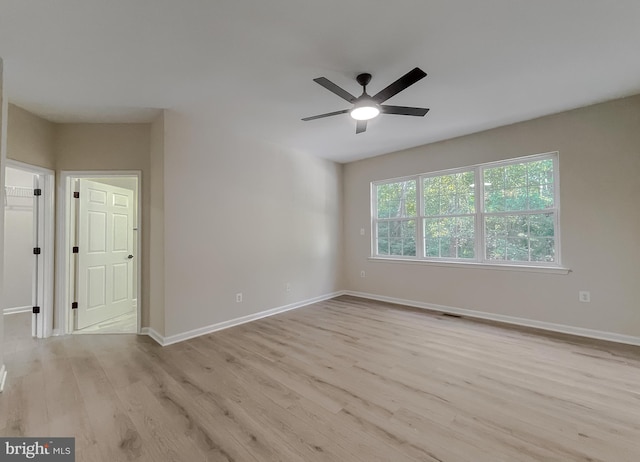 unfurnished room with light hardwood / wood-style floors and ceiling fan