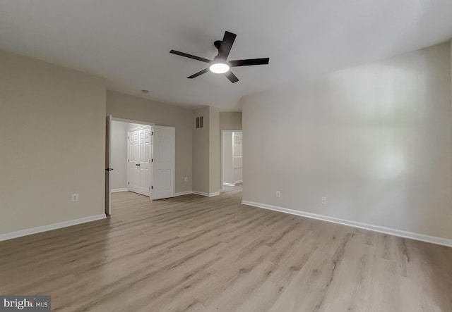 spare room featuring light hardwood / wood-style floors and ceiling fan