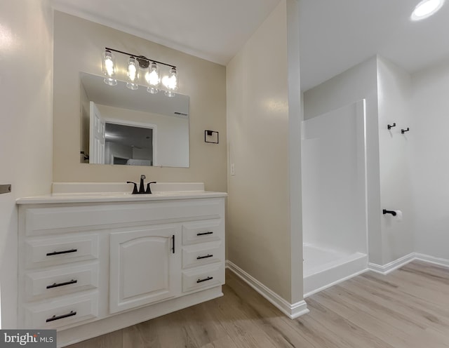 bathroom featuring vanity and hardwood / wood-style floors