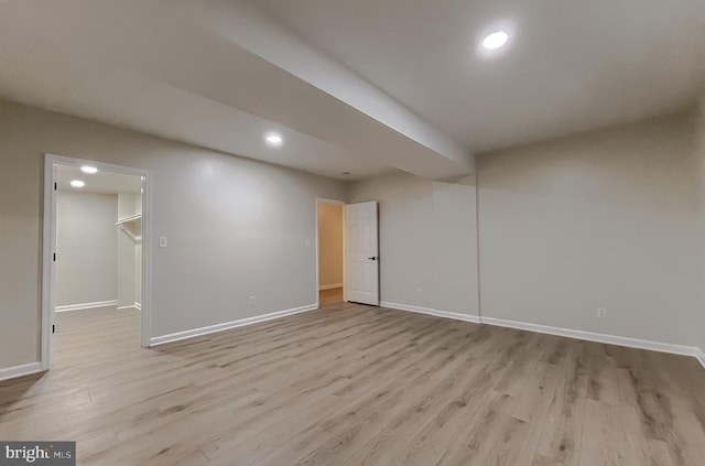 basement featuring light hardwood / wood-style flooring