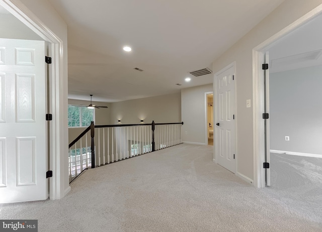 corridor with light carpet