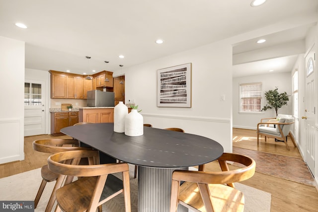 dining room featuring light hardwood / wood-style floors