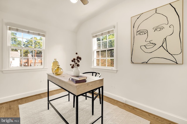 office space with lofted ceiling, hardwood / wood-style floors, and ceiling fan