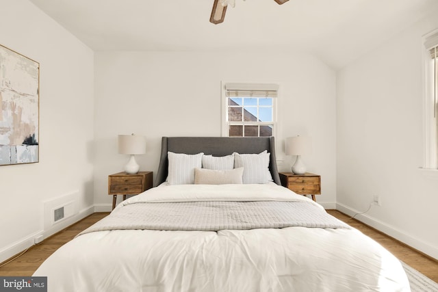 bedroom with ceiling fan and light hardwood / wood-style floors