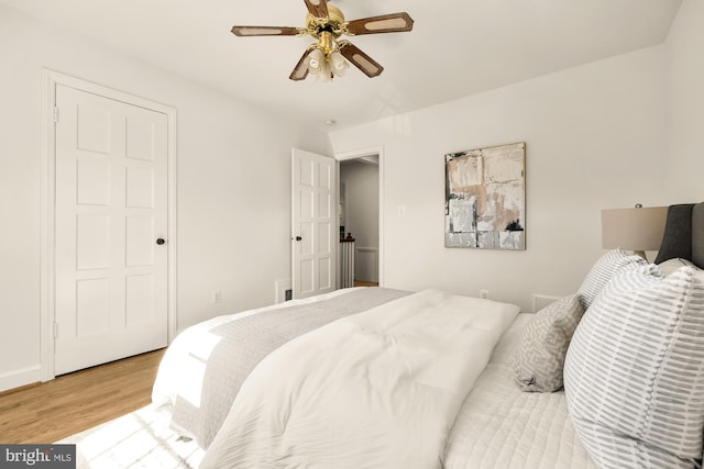 bedroom with hardwood / wood-style flooring and ceiling fan