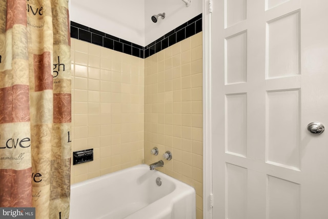 bathroom featuring shower / bath combination with curtain