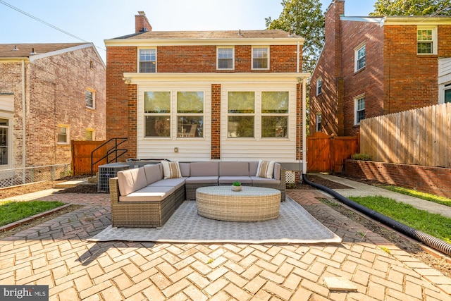 rear view of house featuring central air condition unit, a patio area, and outdoor lounge area