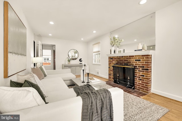 living room featuring hardwood / wood-style floors and a fireplace