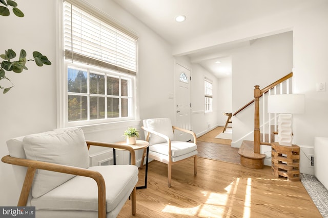 living area with light hardwood / wood-style flooring