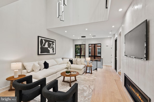 living room with light hardwood / wood-style flooring