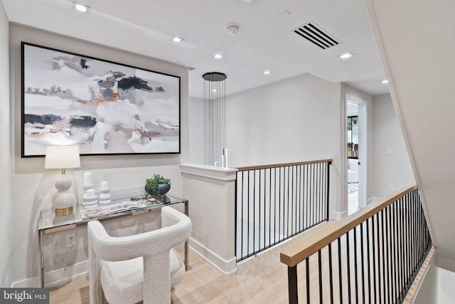 hall with light hardwood / wood-style flooring