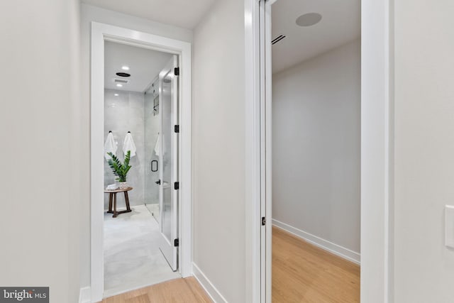 hallway featuring hardwood / wood-style floors