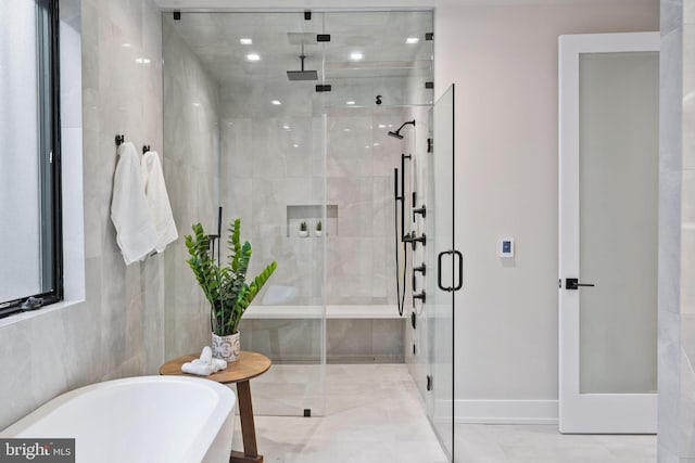 bathroom featuring separate shower and tub and tile patterned floors