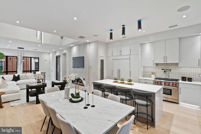 dining room with light hardwood / wood-style flooring