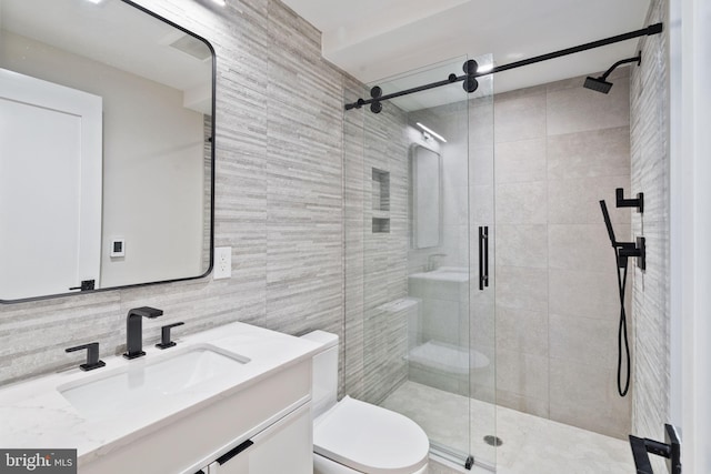 bathroom featuring vanity, an enclosed shower, backsplash, tile walls, and toilet