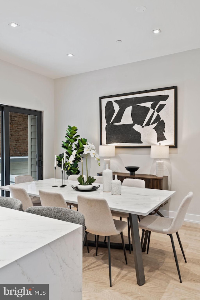 dining area featuring light wood-type flooring