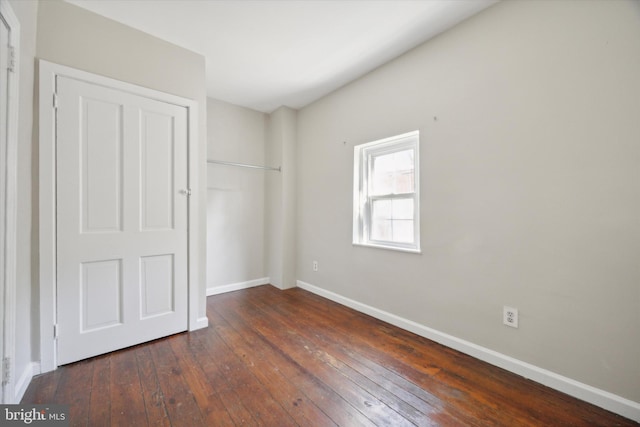 unfurnished bedroom featuring dark wood-type flooring