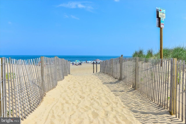 view of water feature with a beach view