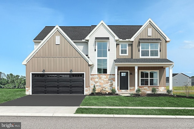 view of front facade featuring a front lawn and a garage