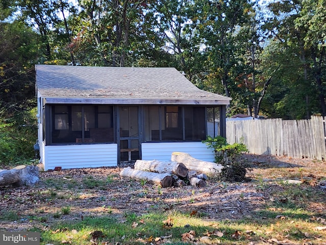 view of front of house with a sunroom