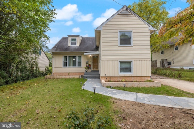 view of front of home with a front yard