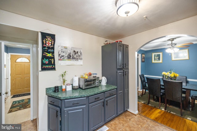 kitchen with light hardwood / wood-style flooring and ceiling fan