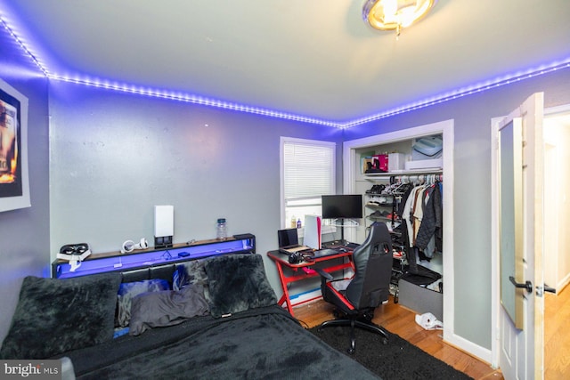 home office with wood-type flooring