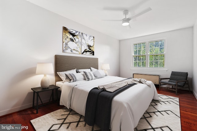 bedroom featuring hardwood / wood-style floors and ceiling fan