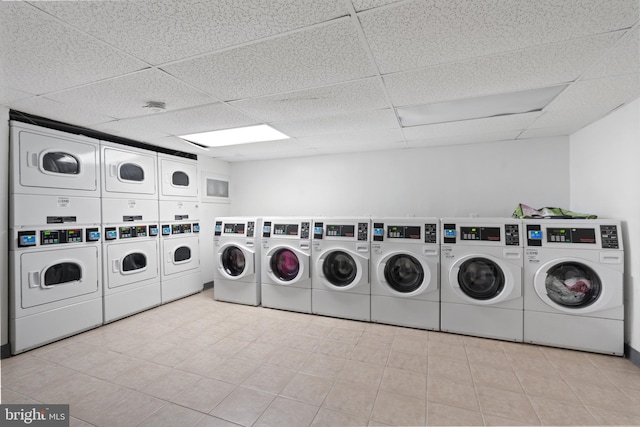 clothes washing area with stacked washer / dryer and separate washer and dryer