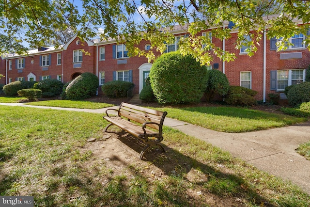 view of community featuring a yard