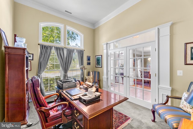 carpeted office space featuring french doors and ornamental molding