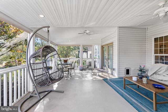 sunroom / solarium featuring ceiling fan and lofted ceiling