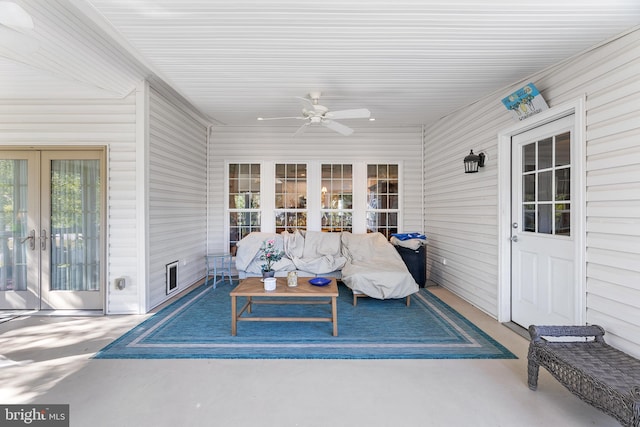 sunroom with ceiling fan and french doors