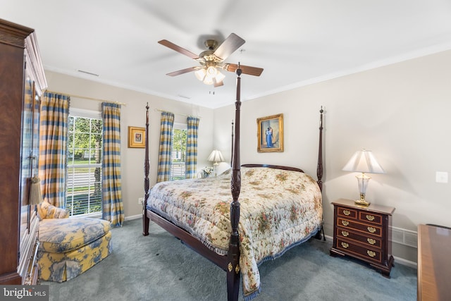 carpeted bedroom with ceiling fan and ornamental molding