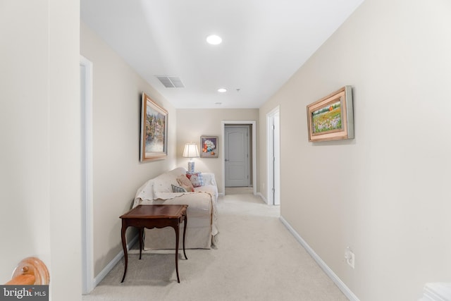 corridor with light carpet