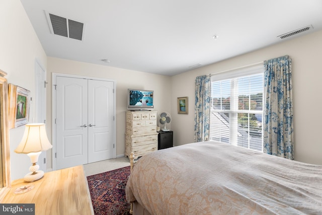 bedroom featuring a closet and carpet