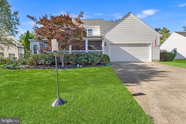 new england style home featuring a garage and a front yard