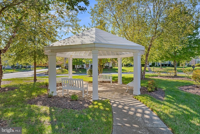 view of property's community featuring a gazebo and a lawn