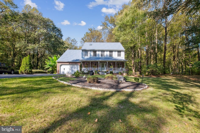 view of front of house with a porch, a front lawn, and a garage