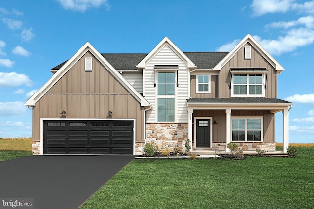 view of front facade with a front yard, a porch, and a garage