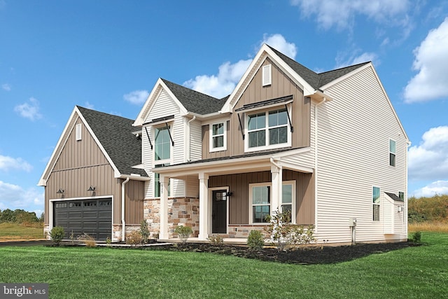 view of front of home with a porch, a garage, and a front lawn