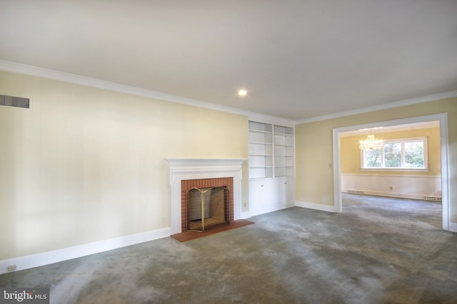 unfurnished living room with dark carpet, ornamental molding, a brick fireplace, and an inviting chandelier