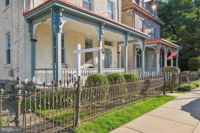 view of side of property featuring a porch