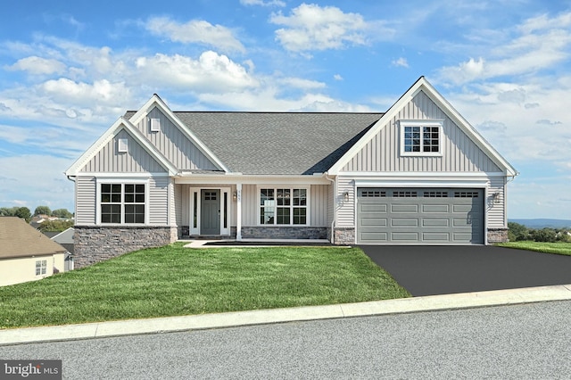 565 Bella May Cir, Lebanon, PA 17046 - craftsman-style home featuring board and batten siding, driveway, stone siding, and a front lawn