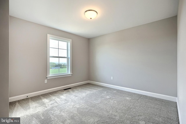 unfurnished room with carpet flooring