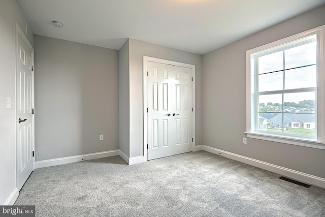 565 Bella May Cir, Lebanon, PA 17046 - unfurnished bedroom with baseboards, a closet, visible vents, and carpet