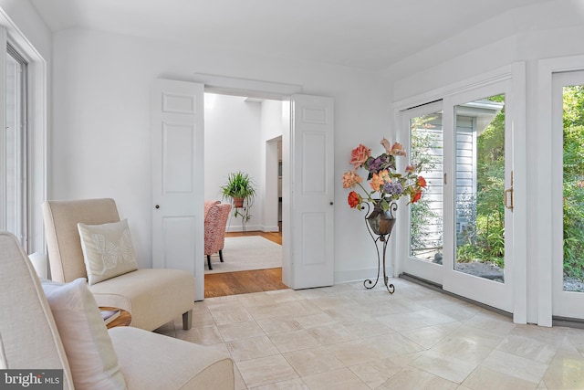 living area with light hardwood / wood-style flooring