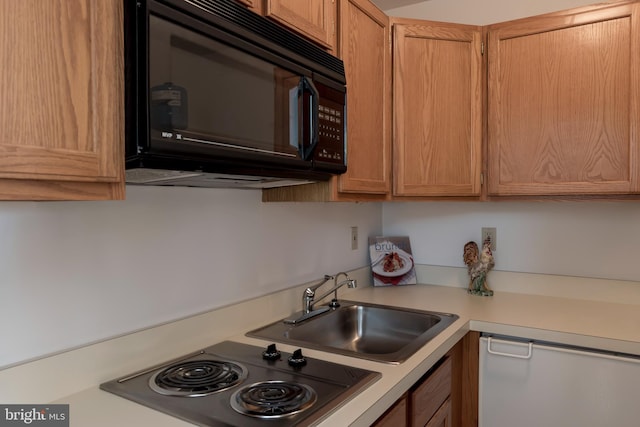 kitchen with sink and stainless steel electric cooktop